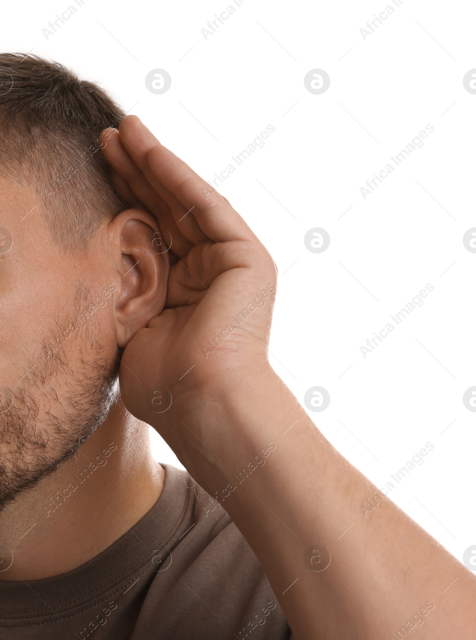 Photo of Man showing hand to ear gesture on white background, closeup