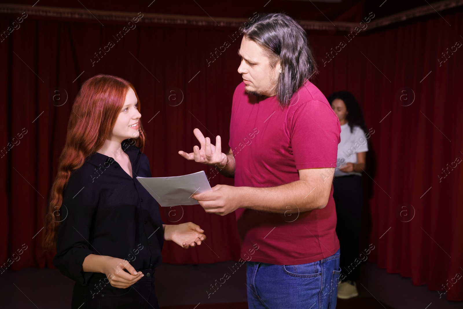 Photo of Professional actors rehearsing on stage in theatre