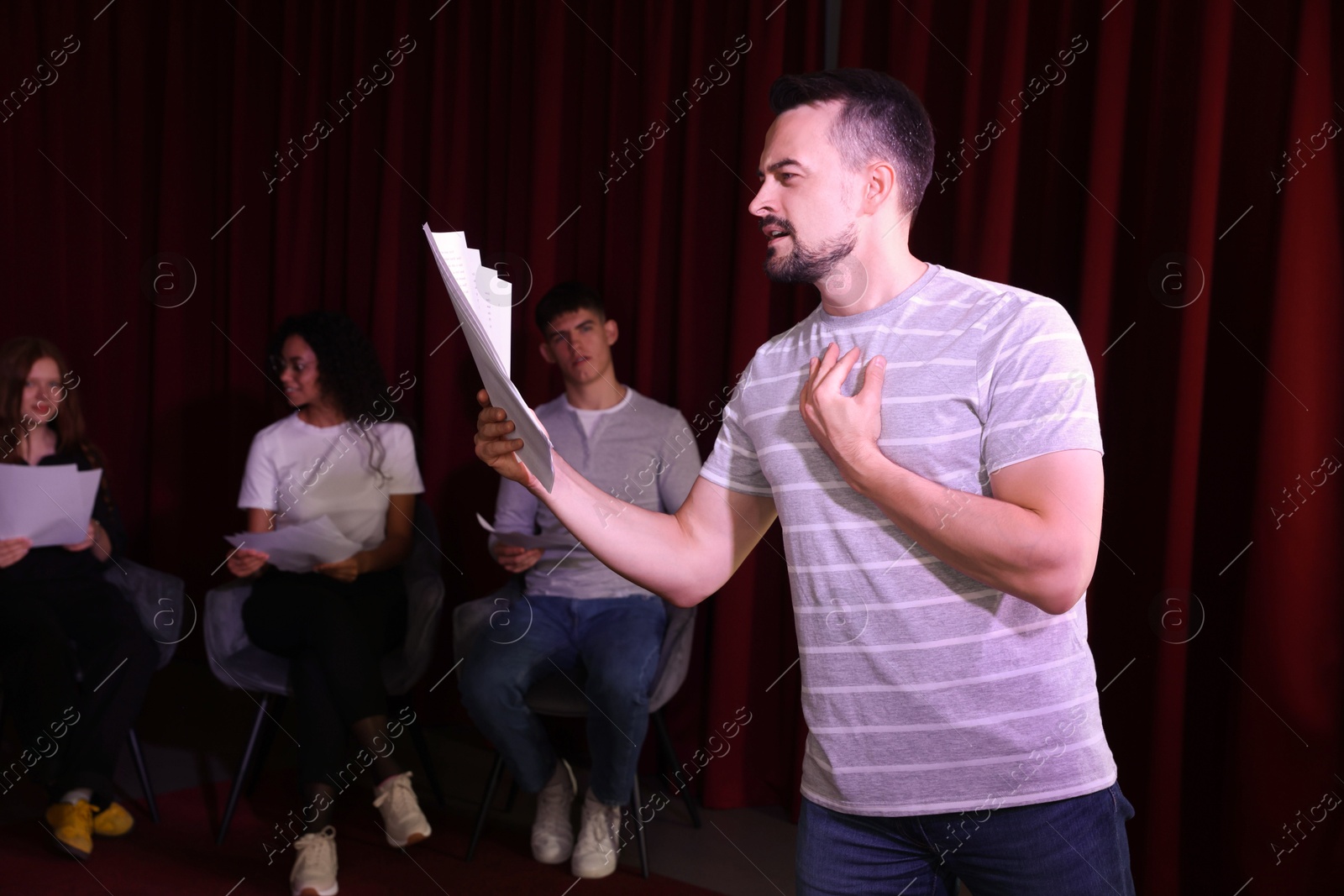 Photo of Professional actor rehearsing on stage in theatre