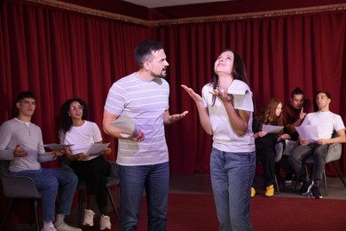 Photo of Professional actors rehearsing on stage in theatre