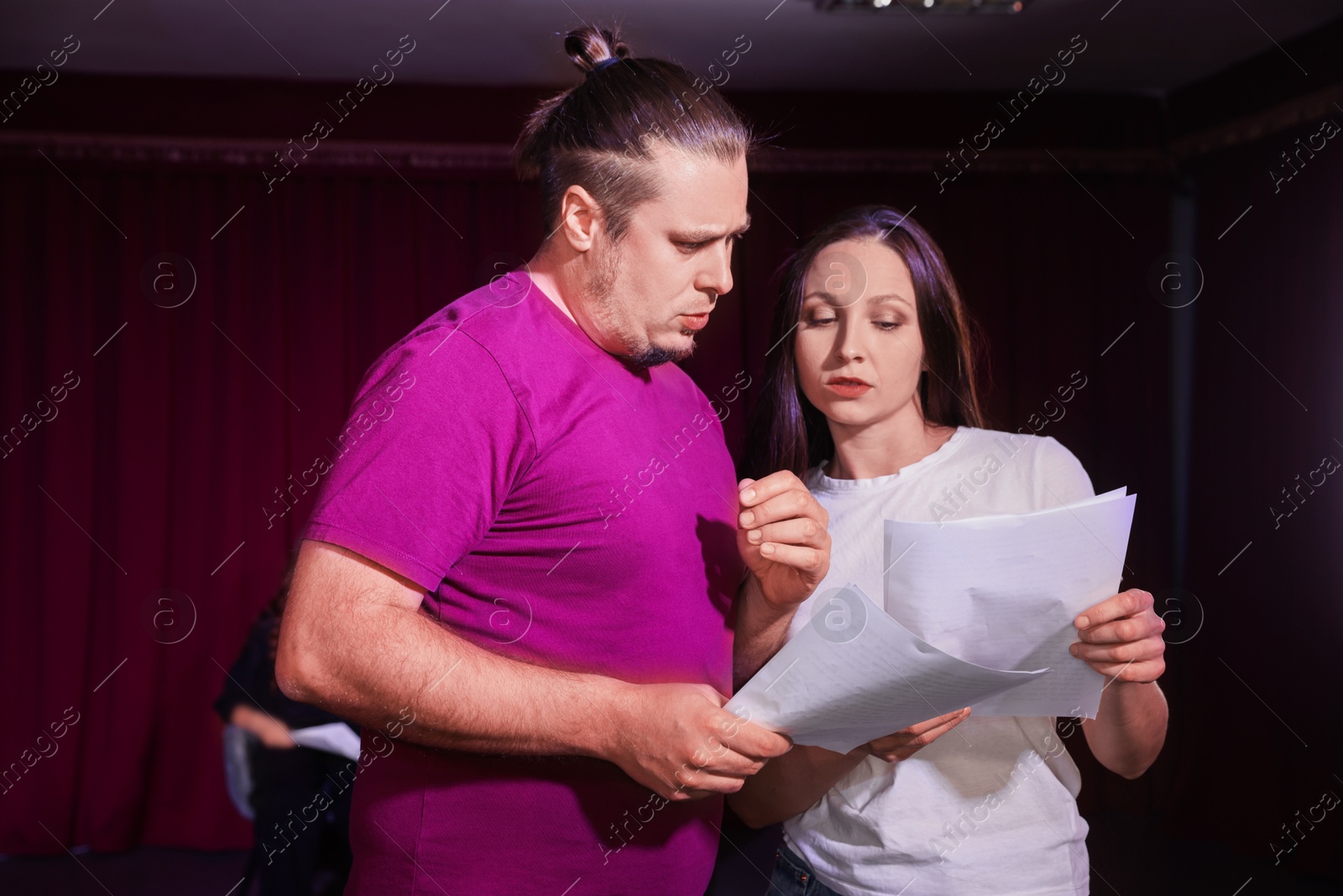 Photo of Professional actors rehearsing on stage in theatre