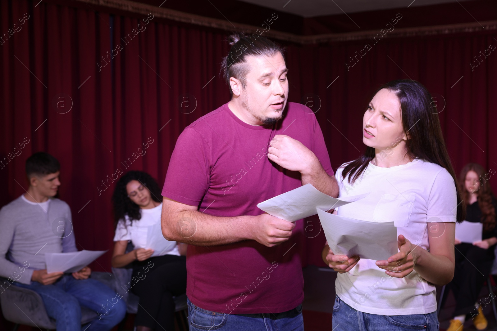 Photo of Professional actors rehearsing on stage in theatre