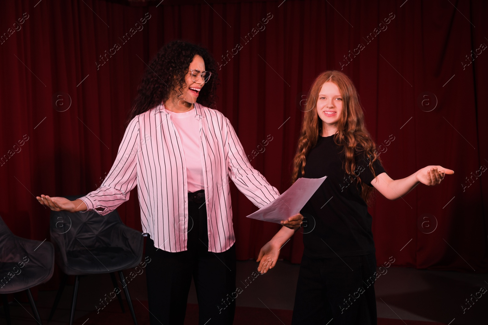 Photo of Professional actors rehearsing on stage in theatre