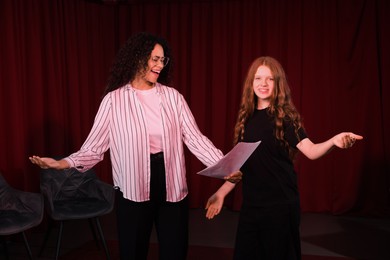 Photo of Professional actors rehearsing on stage in theatre