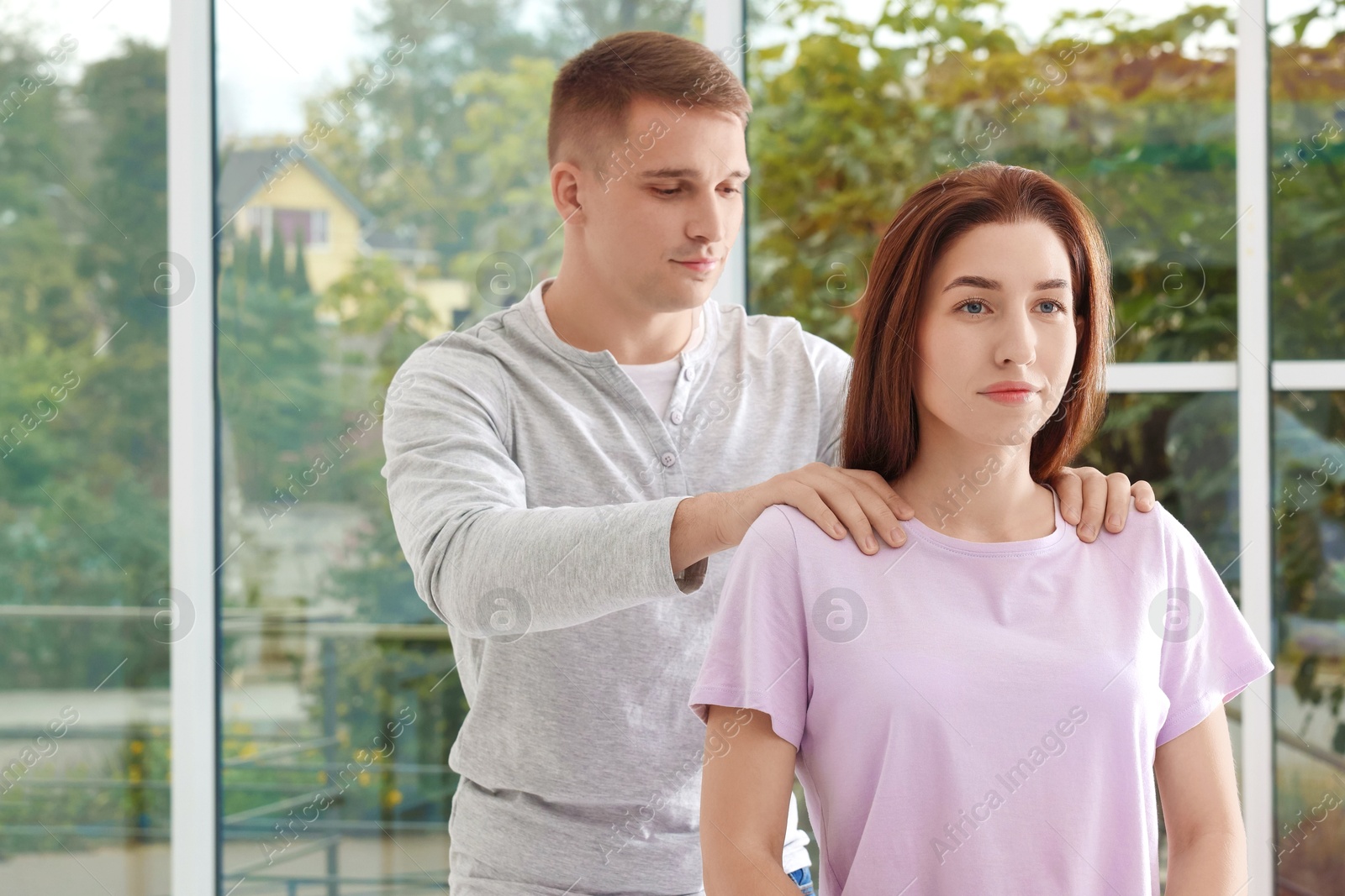 Photo of Osteopath working with patient in clinic. Manual therapy