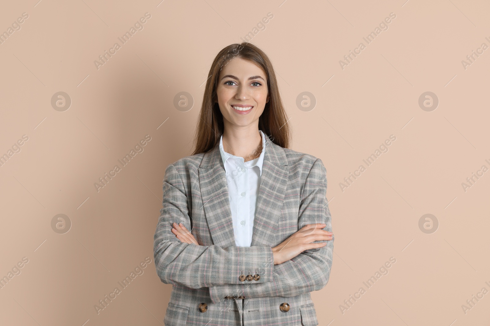 Photo of Portrait of smiling banker on beige background