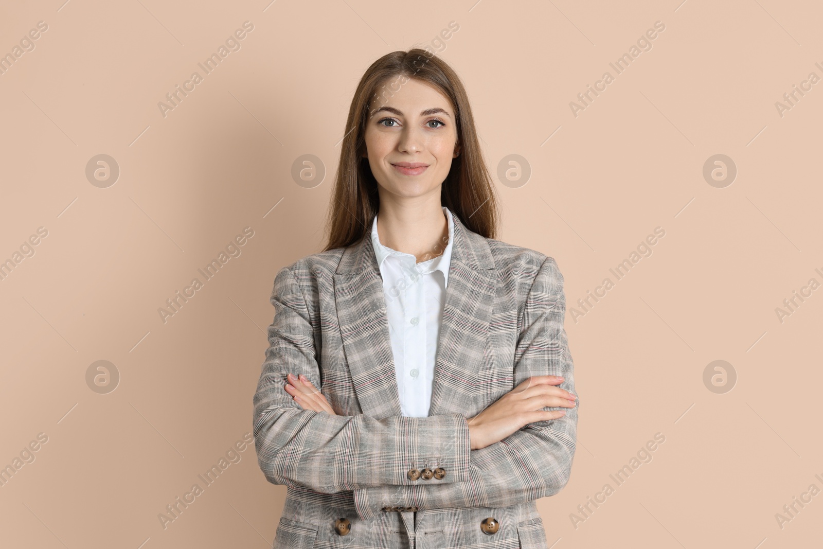 Photo of Portrait of smiling banker on beige background