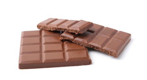 Photo of Pieces of delicious milk chocolate isolated on white