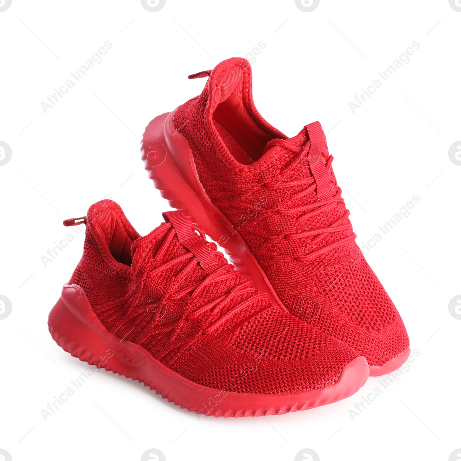 Photo of Pair of stylish red sneakers isolated on white