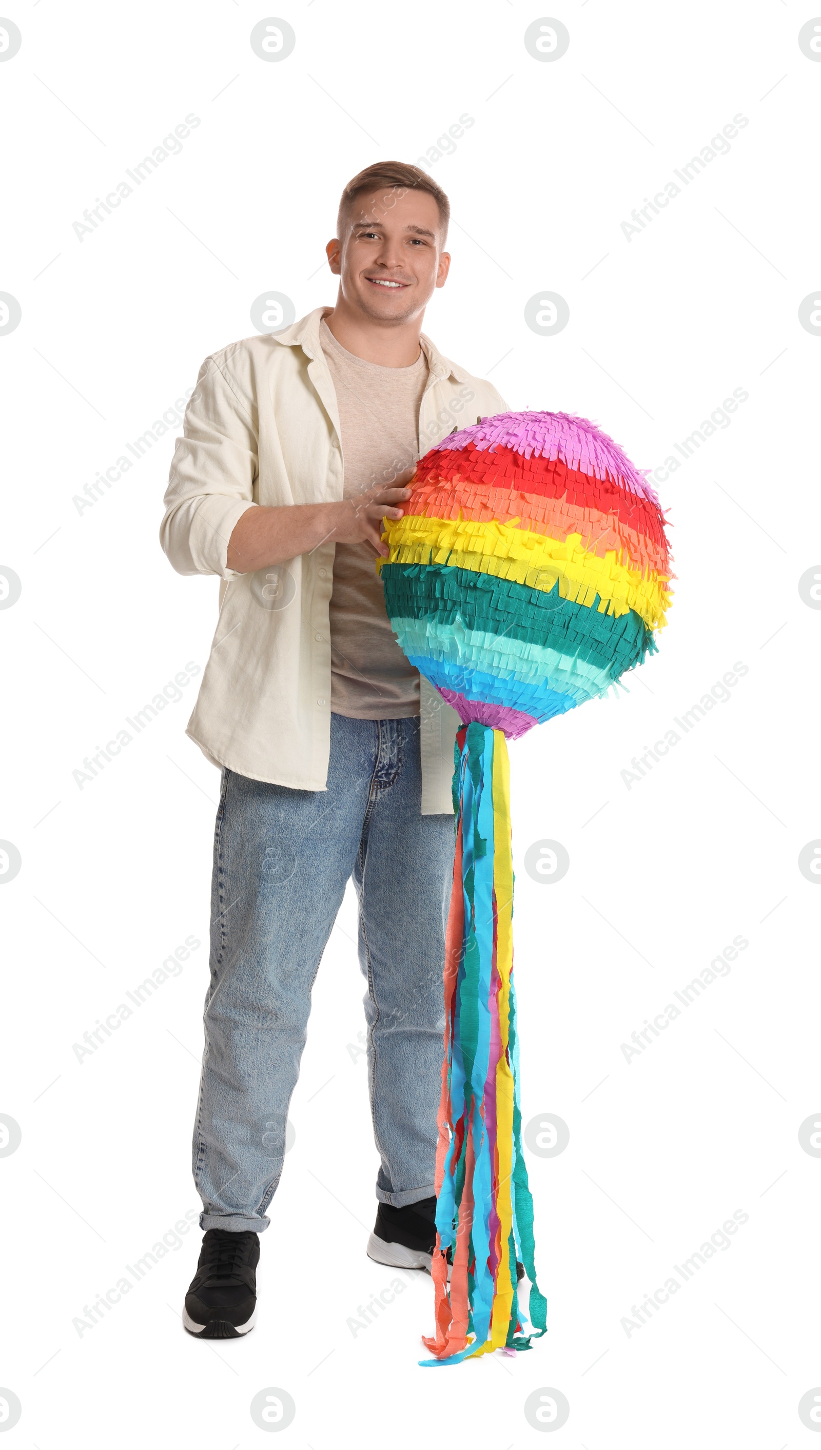 Photo of Happy man with colorful pinata on white background