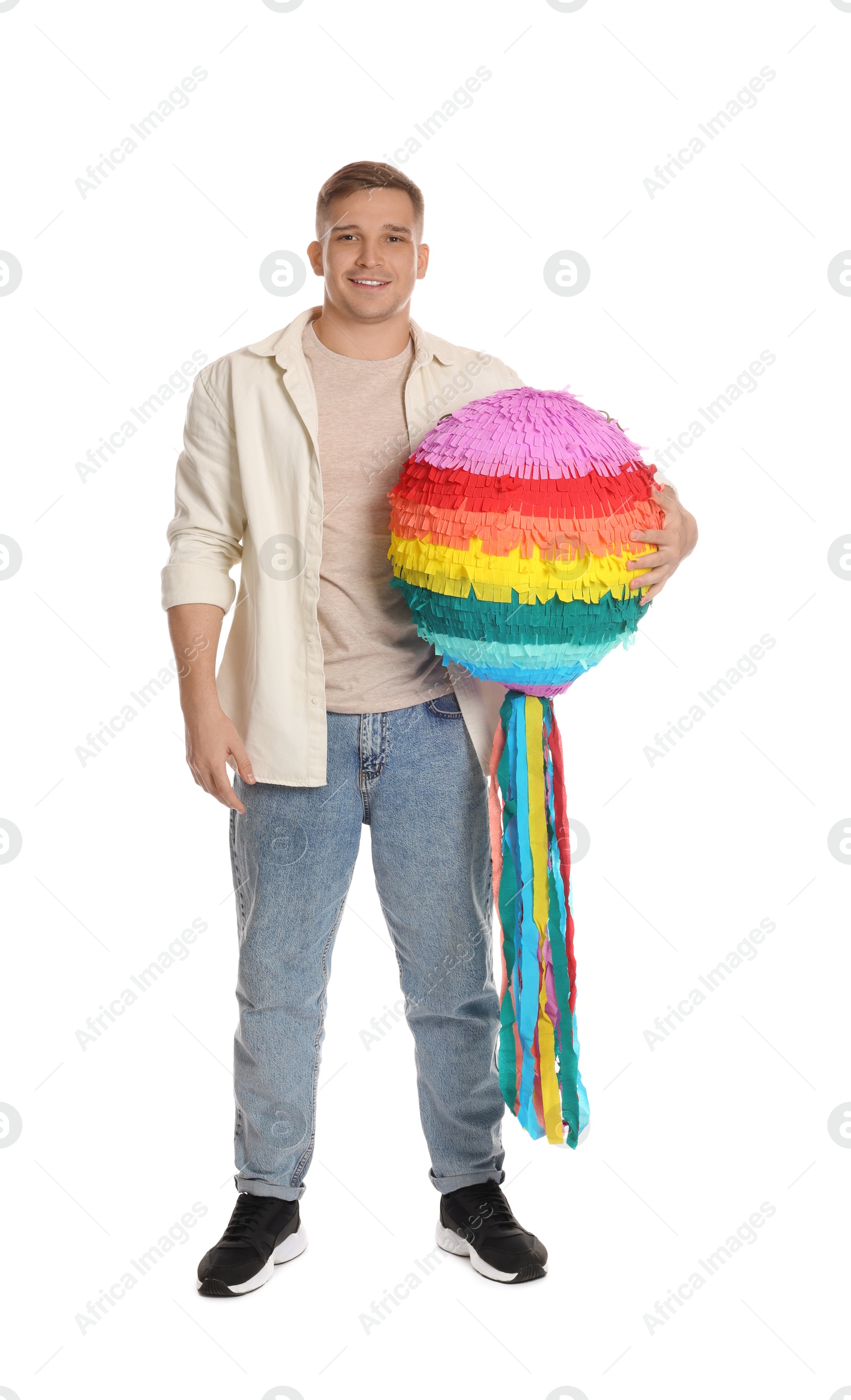 Photo of Happy man with colorful pinata on white background