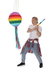 Photo of Happy man breaking pinata on white background