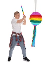 Photo of Happy man breaking pinata on white background