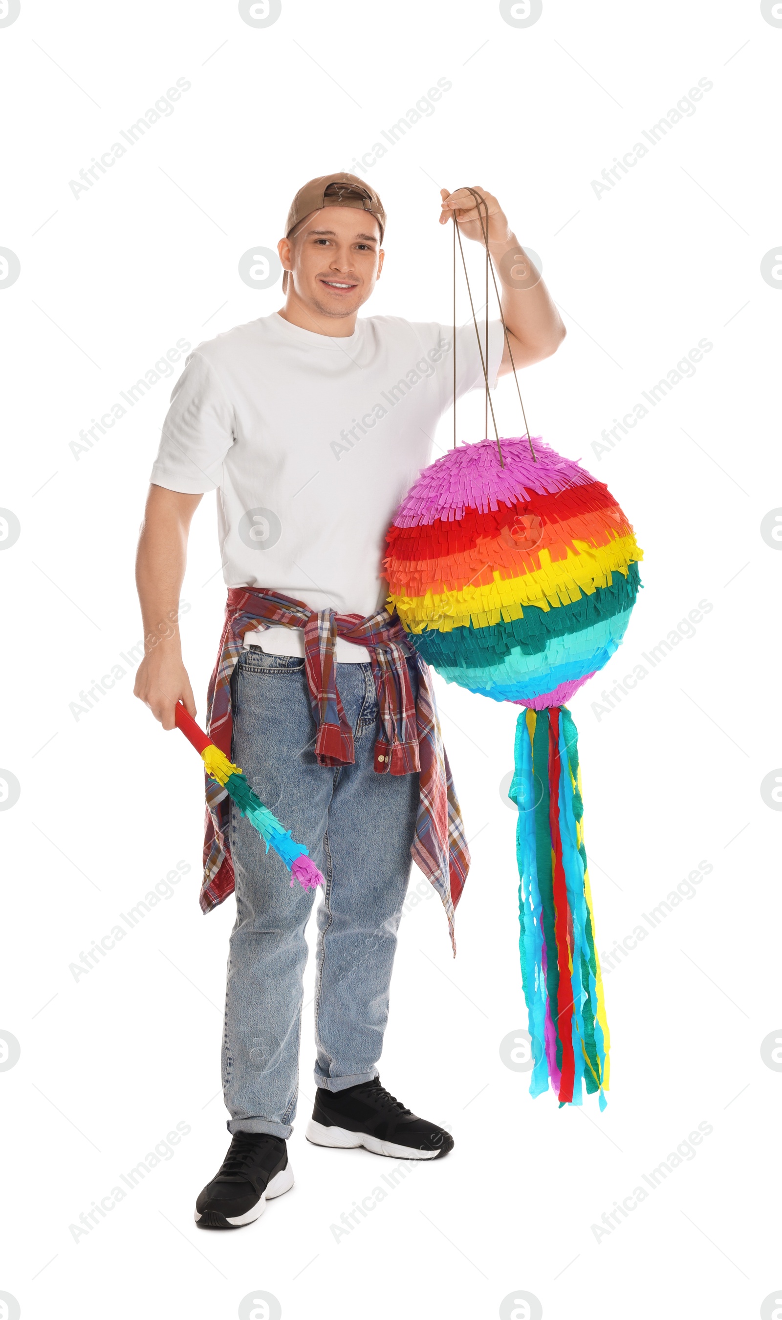 Photo of Happy man with colorful pinata and stick on white background