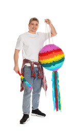 Photo of Happy man with colorful pinata and stick on white background