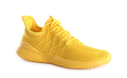 Photo of One stylish yellow sneaker isolated on white