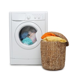 Photo of Modern washing machine and laundry basket isolated on white