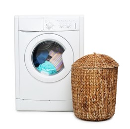 Photo of Modern washing machine and laundry basket isolated on white