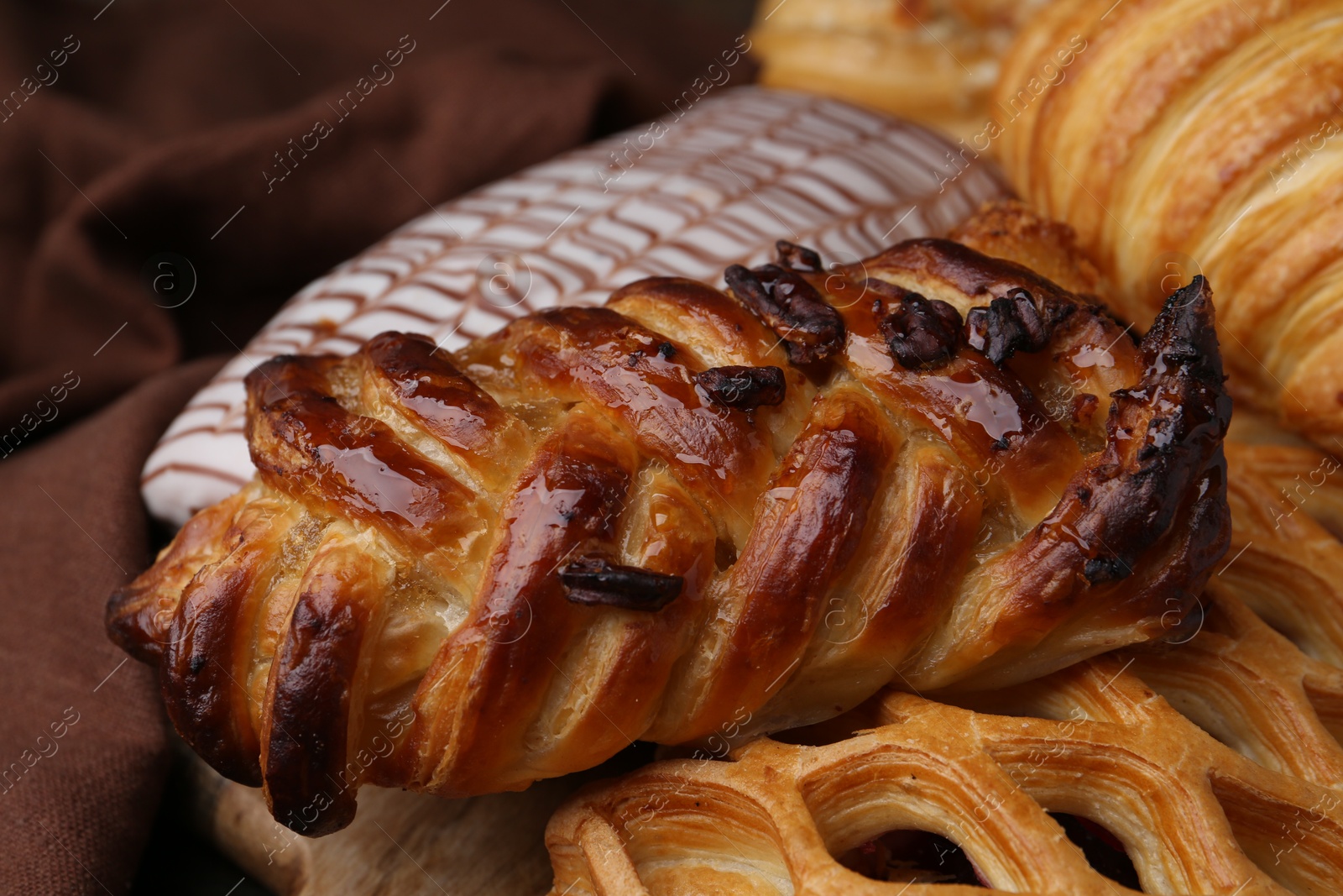 Photo of Different delicious sweet pastries on table, closeup