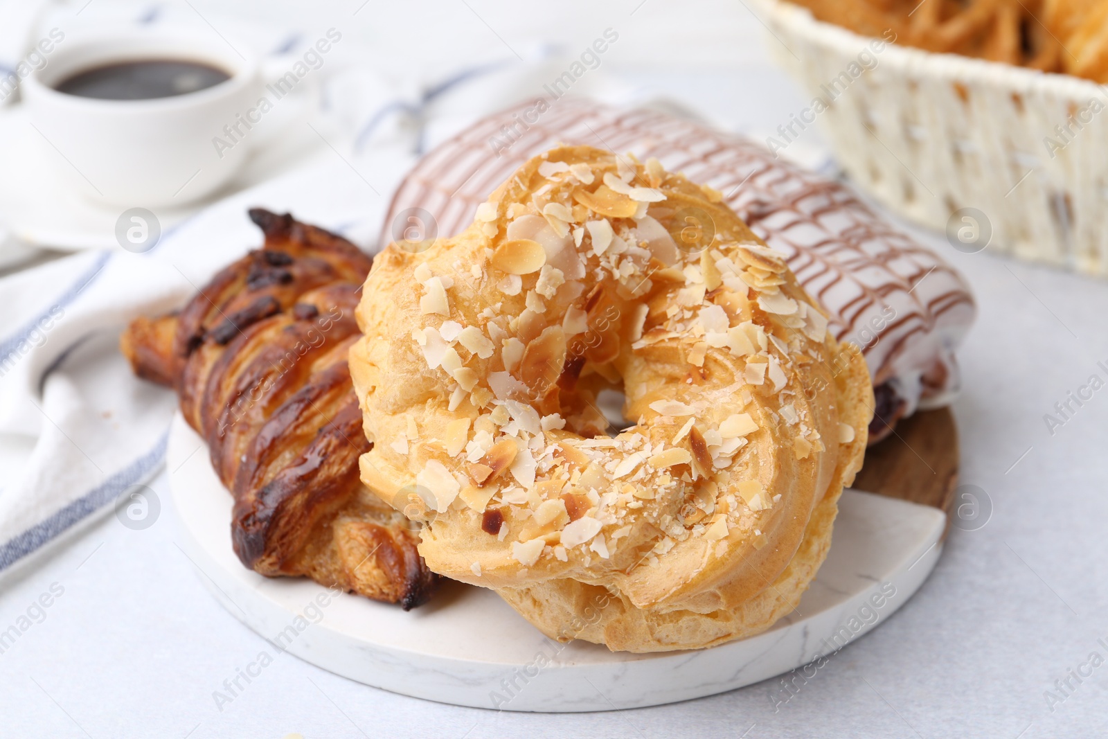 Photo of Different sweet pastries on light table, closeup