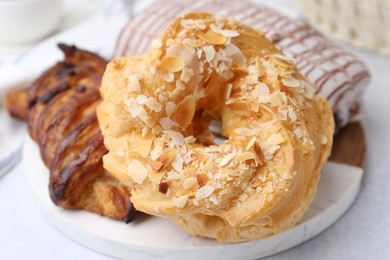 Photo of Different sweet pastries on light table, closeup