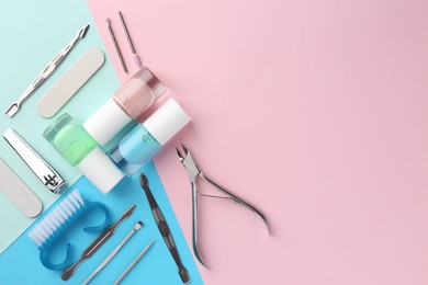 Photo of Set of pedicure tools on color background, flat lay. Space for text