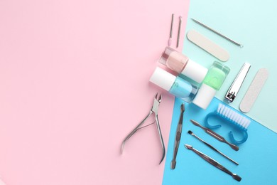 Photo of Set of pedicure tools on color background, flat lay. Space for text