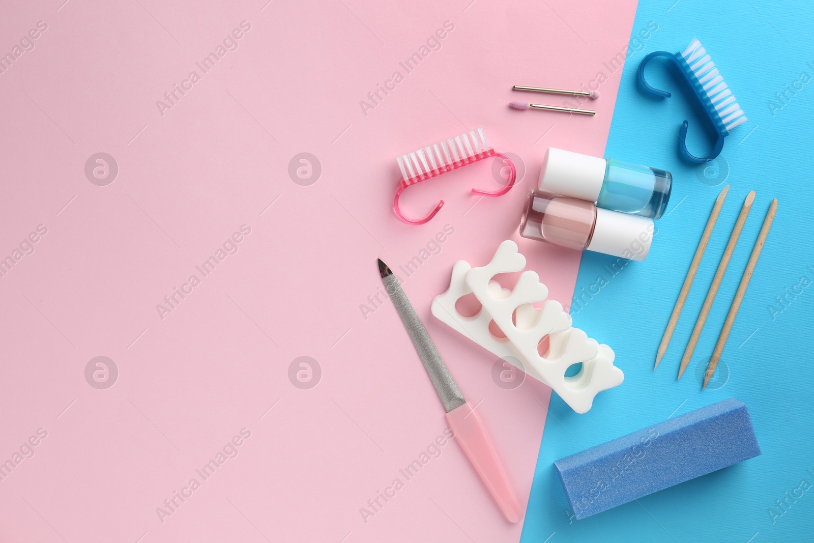 Photo of Set of pedicure tools on color background, flat lay. Space for text