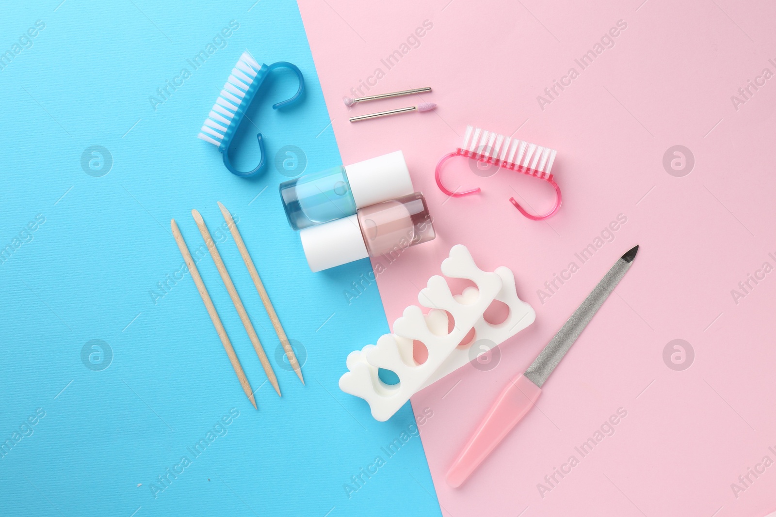 Photo of Set of pedicure tools on color background, flat lay