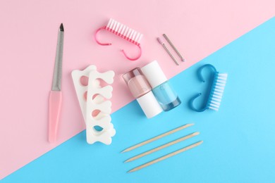 Photo of Set of pedicure tools on color background, flat lay