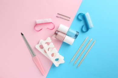 Photo of Set of pedicure tools on color background, flat lay