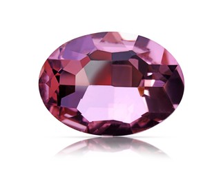 Image of One pink shiny gemstone isolated on white