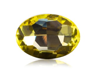 Image of One yellow shiny gemstone isolated on white