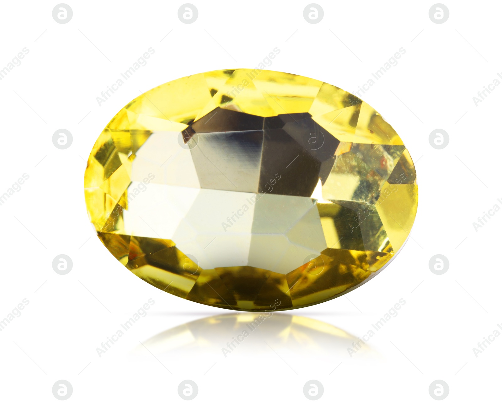 Image of One yellow shiny gemstone isolated on white