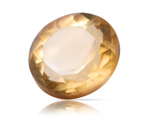 Image of One yellow-orange shiny gemstone isolated on white