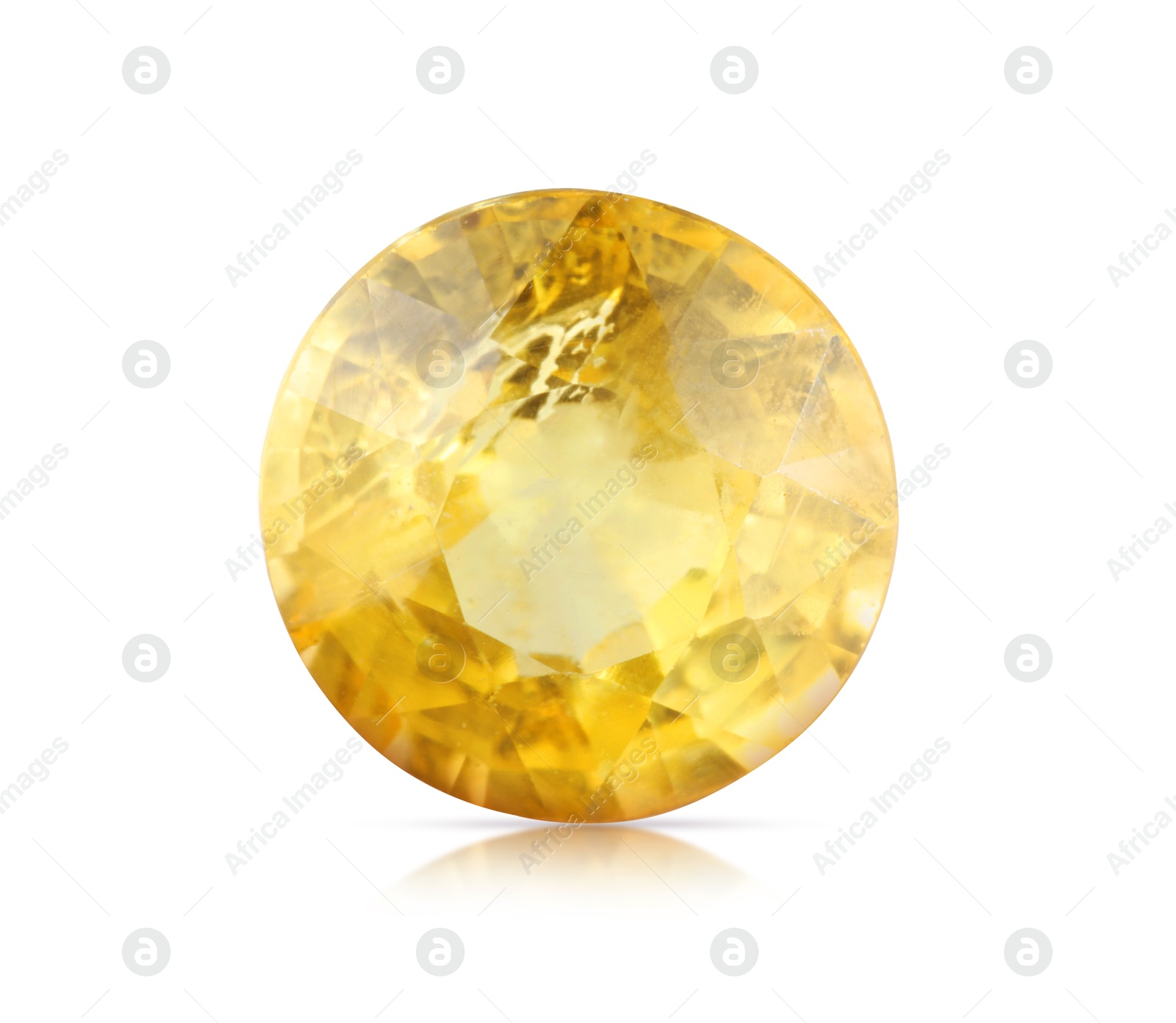 Image of One yellow shiny gemstone isolated on white