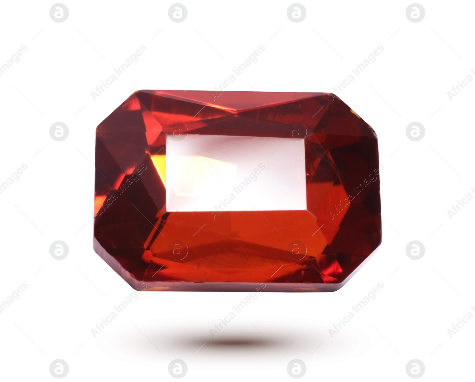 Image of Red shiny gemstone in air on white background