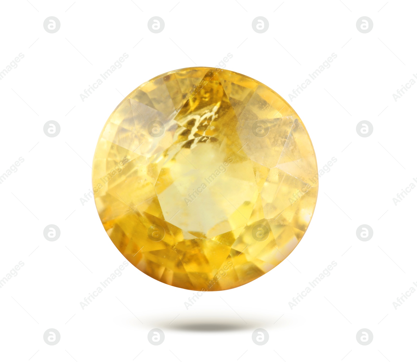 Image of Yellow shiny gemstone in air on white background