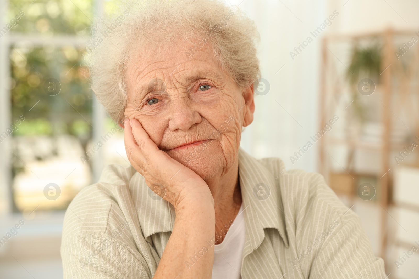 Photo of Portrait of beautiful senior woman at home