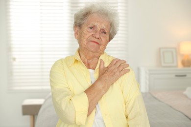 Photo of Portrait of sad senior woman at home