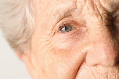 Photo of Senior woman with beautiful eyes, macro view