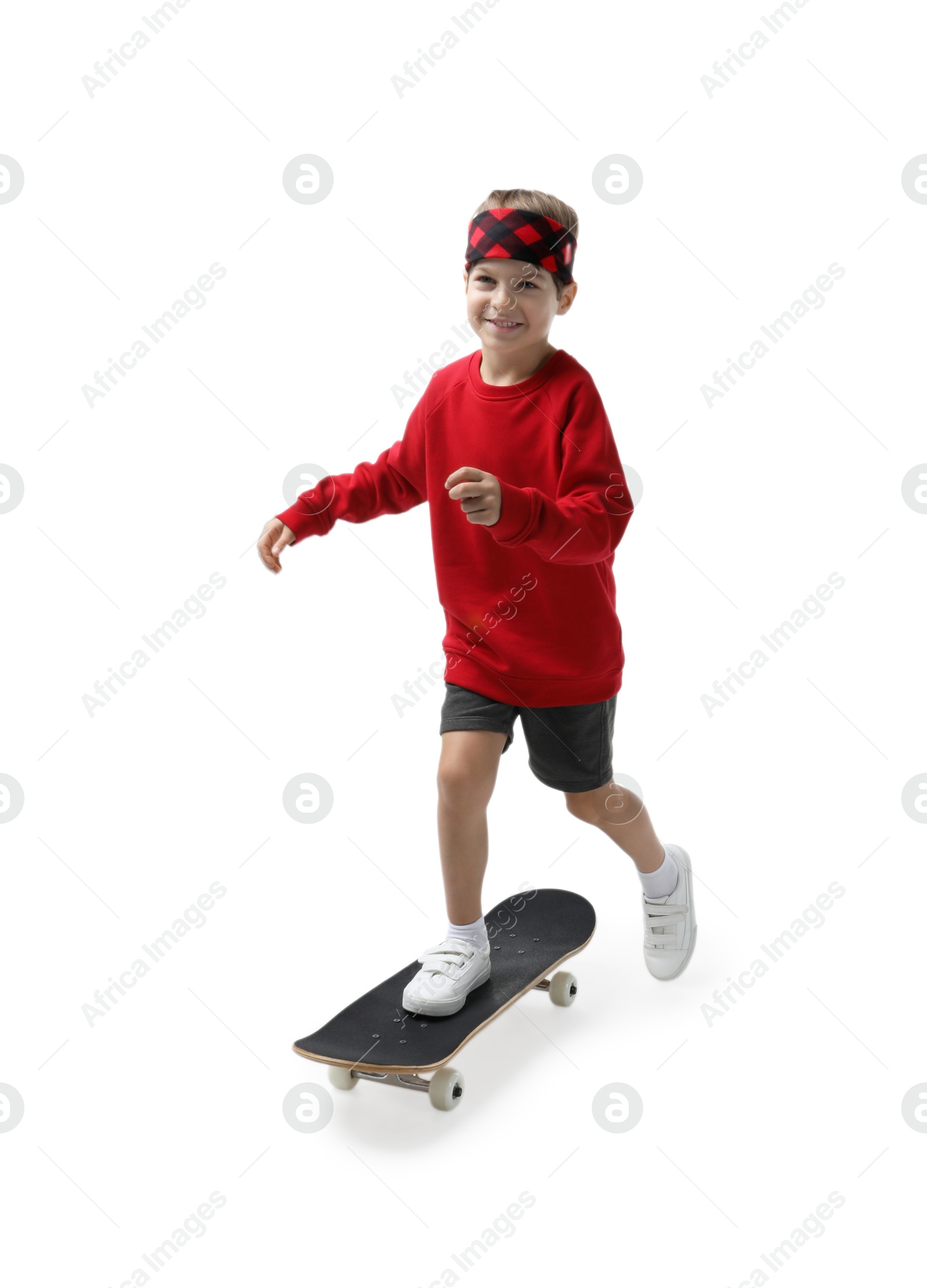 Photo of Little boy with skateboard on white background