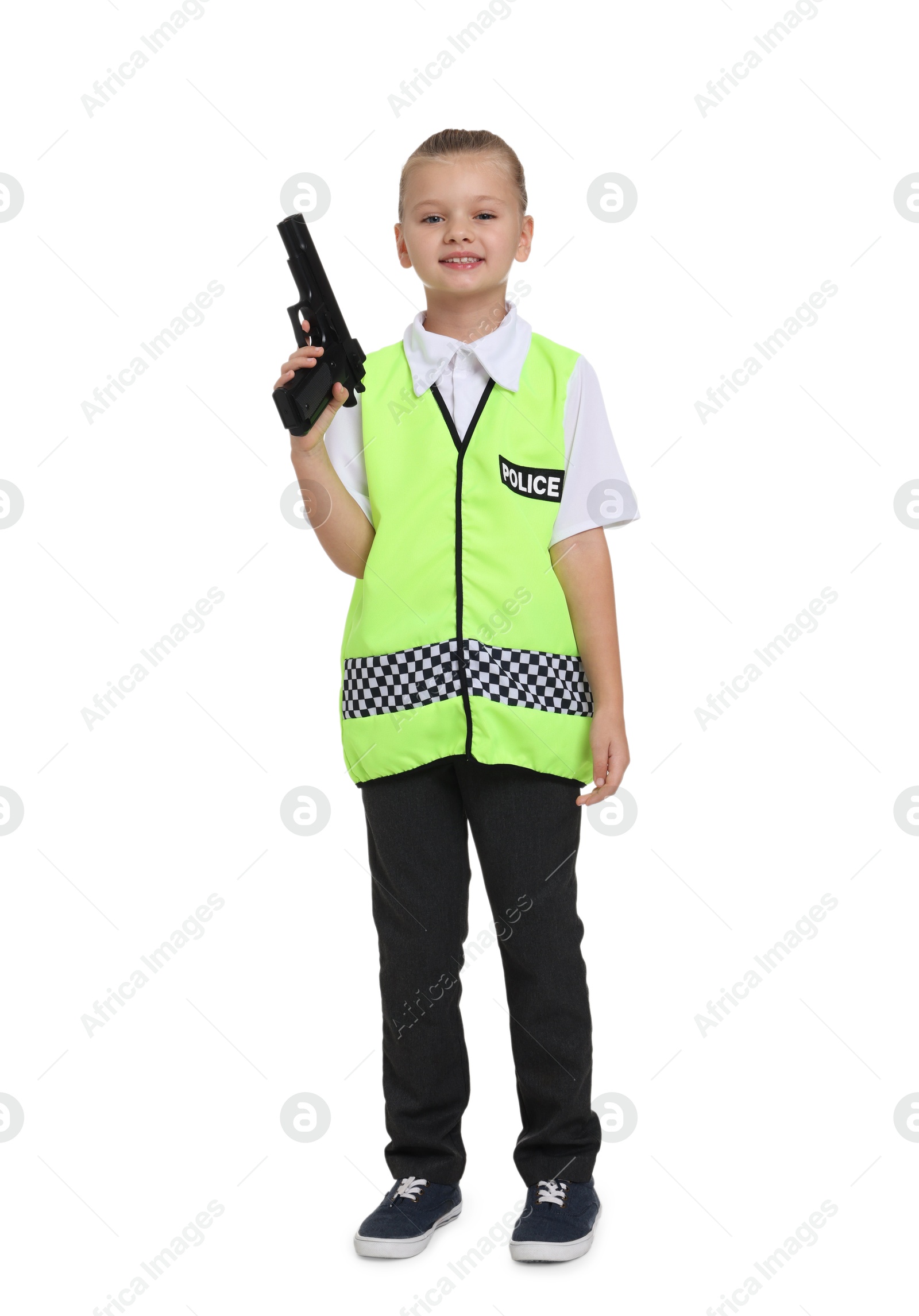 Photo of Little girl with gun pretending to be policewoman on white background. Dreaming of future profession