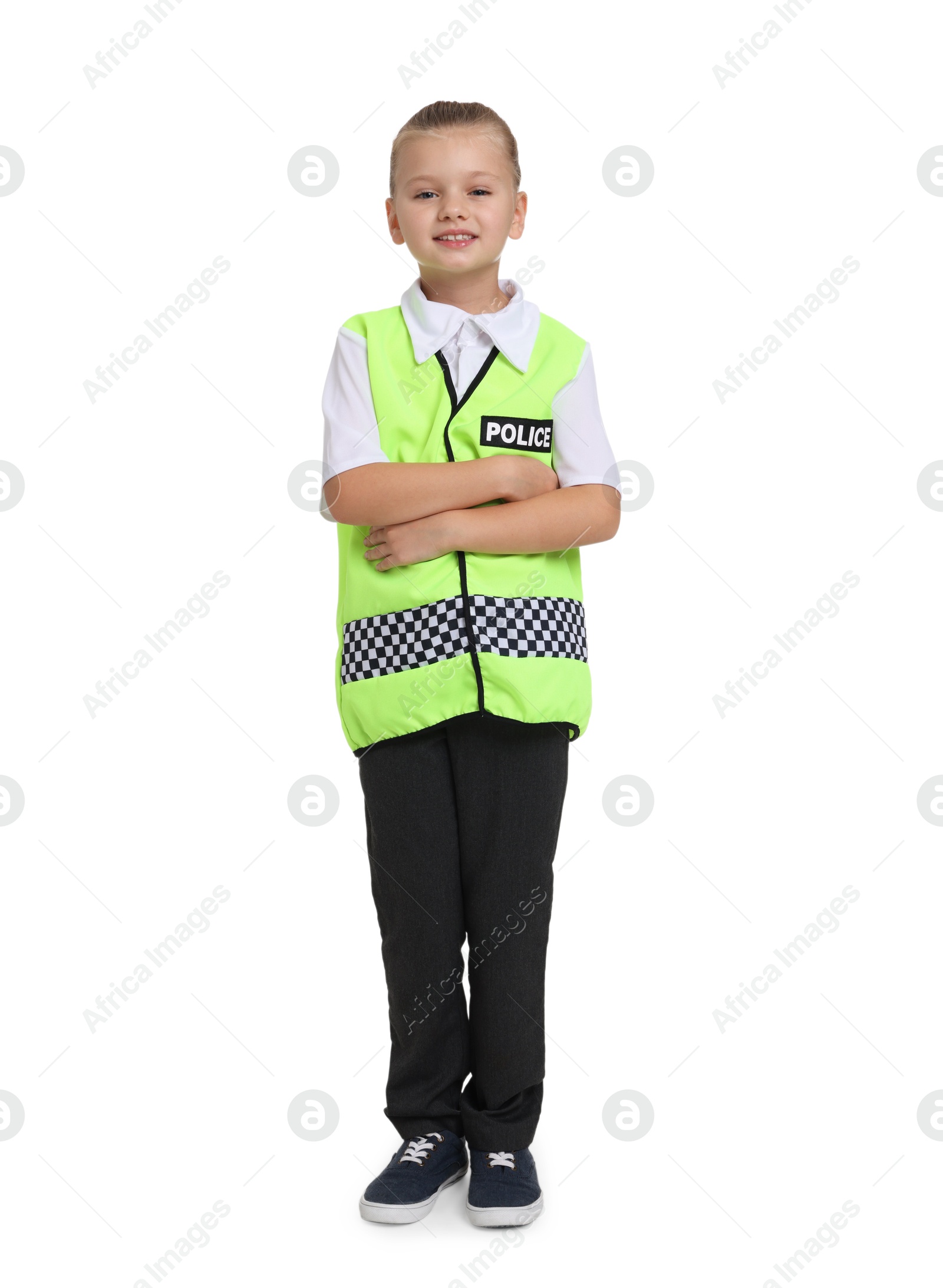 Photo of Little girl pretending to be policewoman on white background. Dreaming of future profession