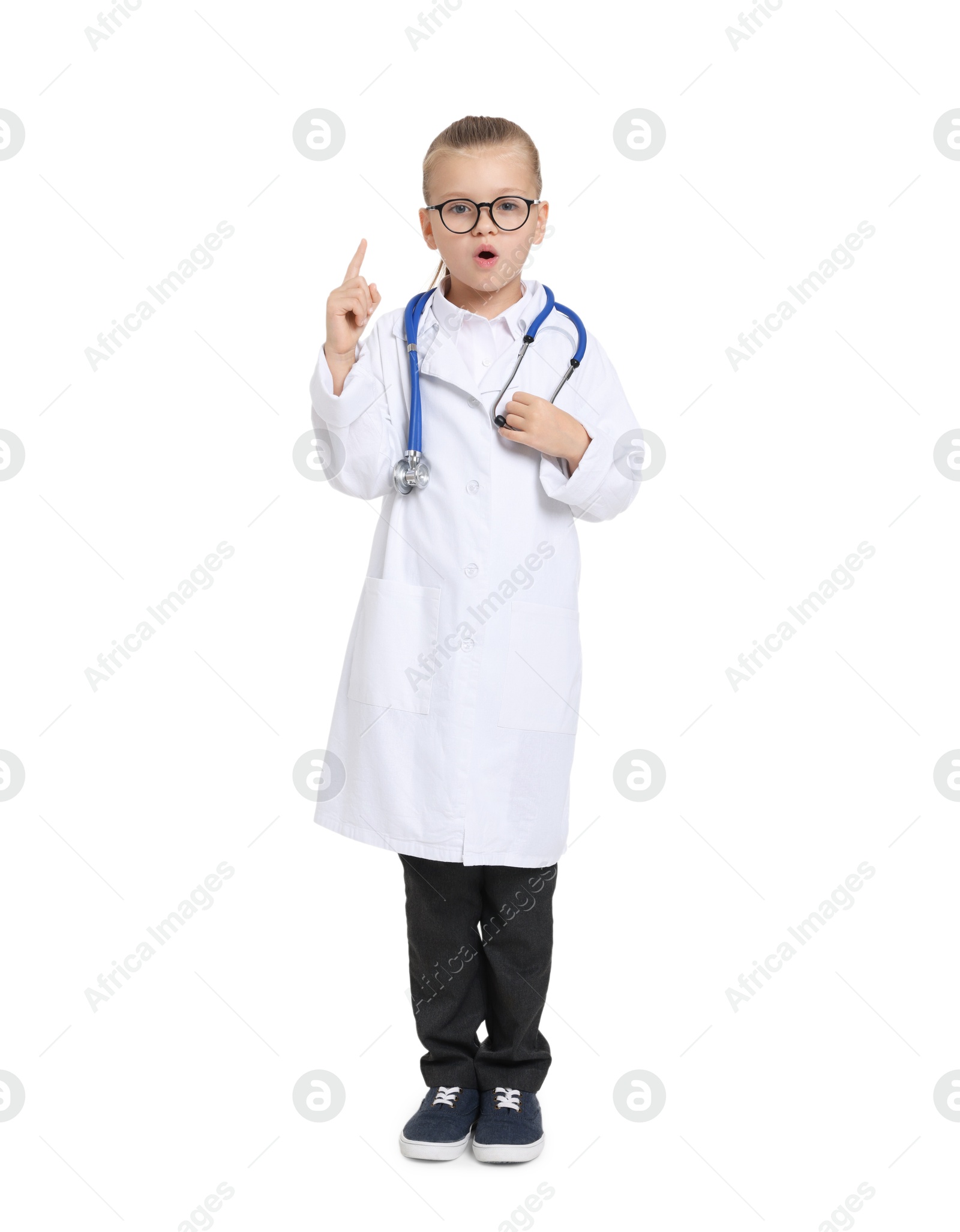 Photo of Little girl with stethoscope pretending to be doctor on white background. Dreaming of future profession