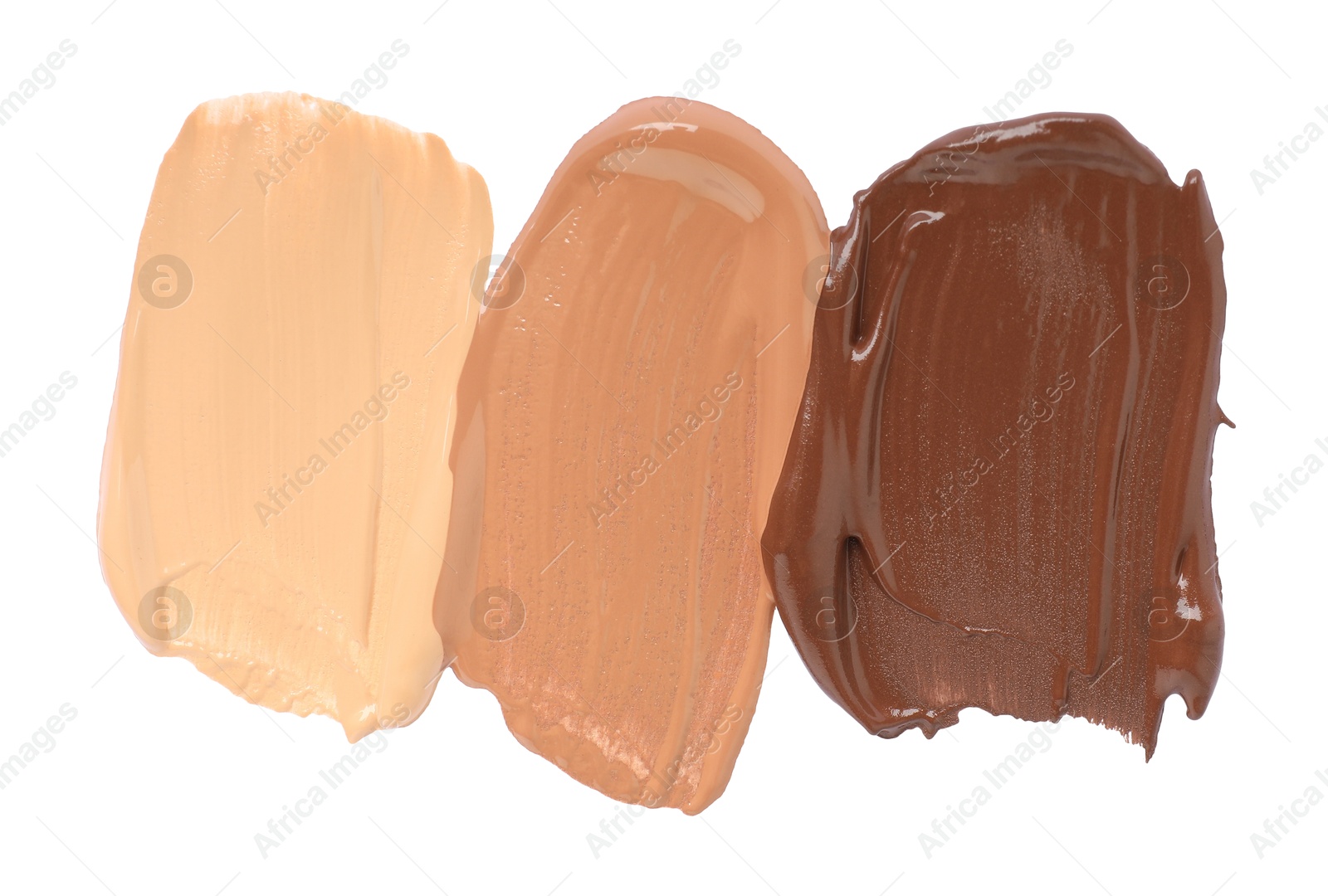 Photo of Samples of different foundation isolated on white, top view