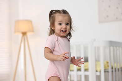 Photo of Portrait of cute little girl at home