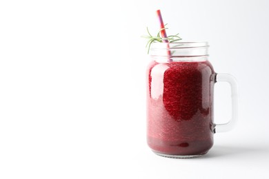 Photo of Fresh beetroot smoothie in mason jar on white background, closeup. Space for text