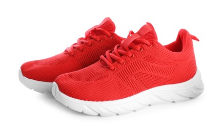 Photo of Pair of stylish red sneakers isolated on white