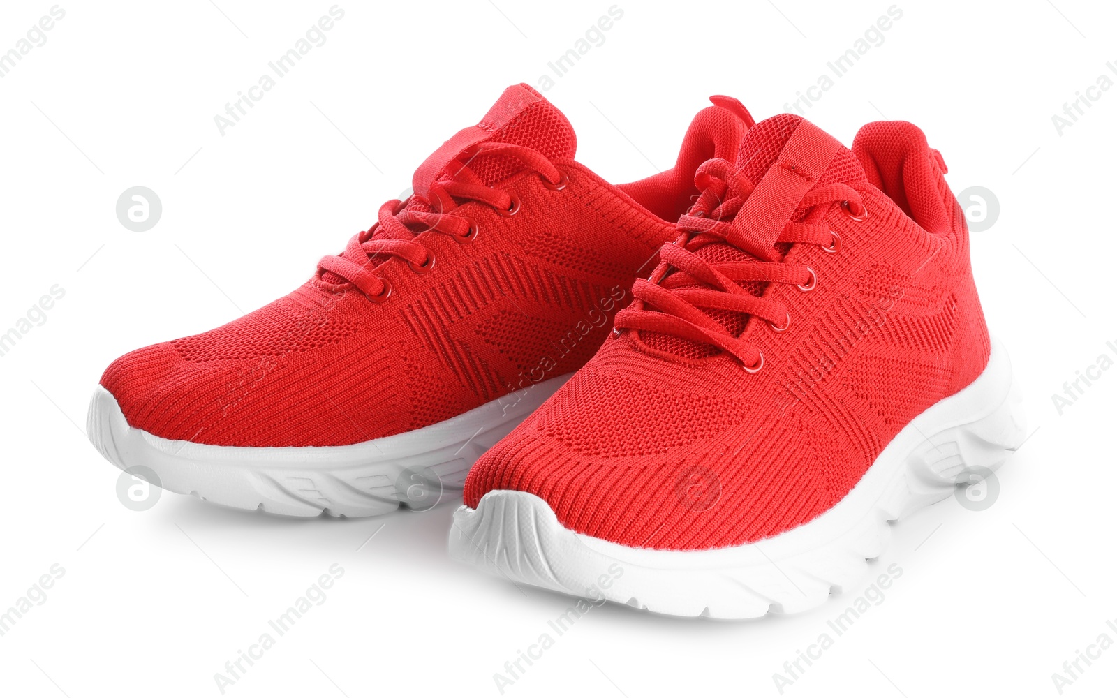 Photo of Pair of stylish red sneakers isolated on white